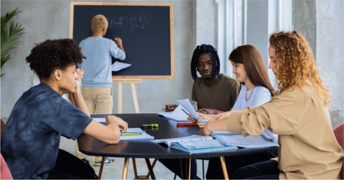 Teachers meeting sitting around a table