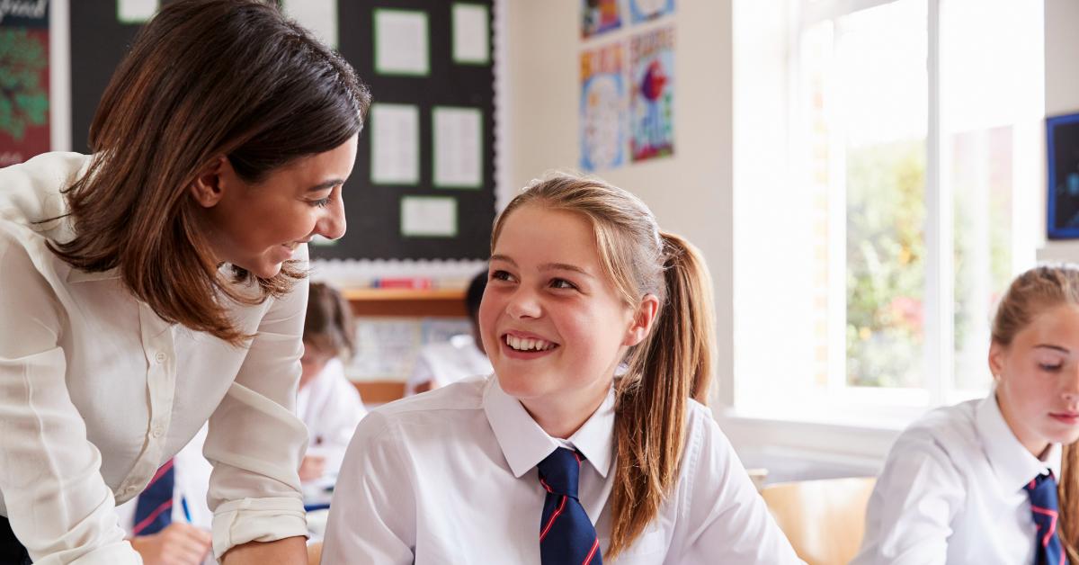 Image of a happy student and teacher